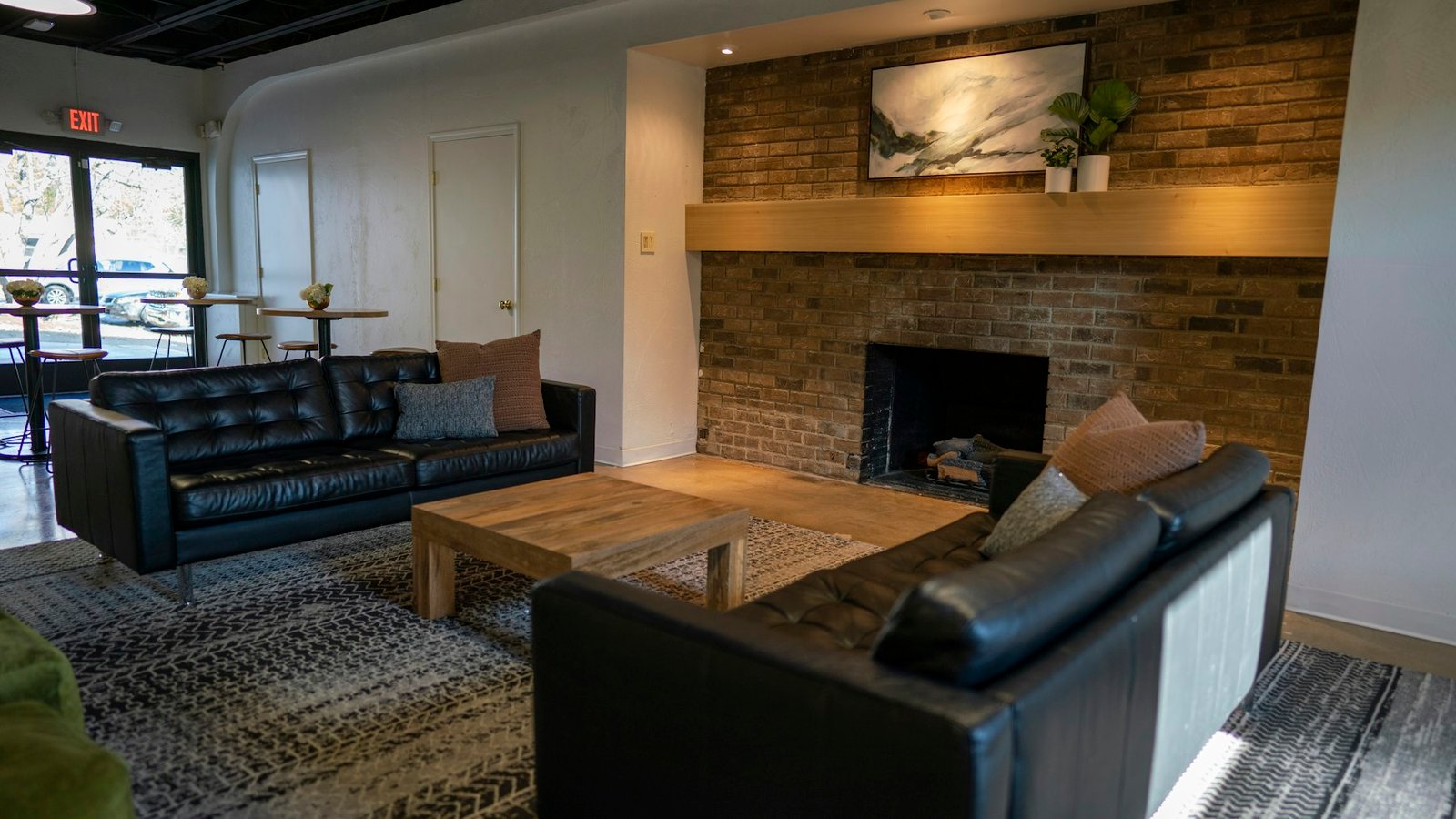 Residential assisted living living room with a fireplace and soft seating