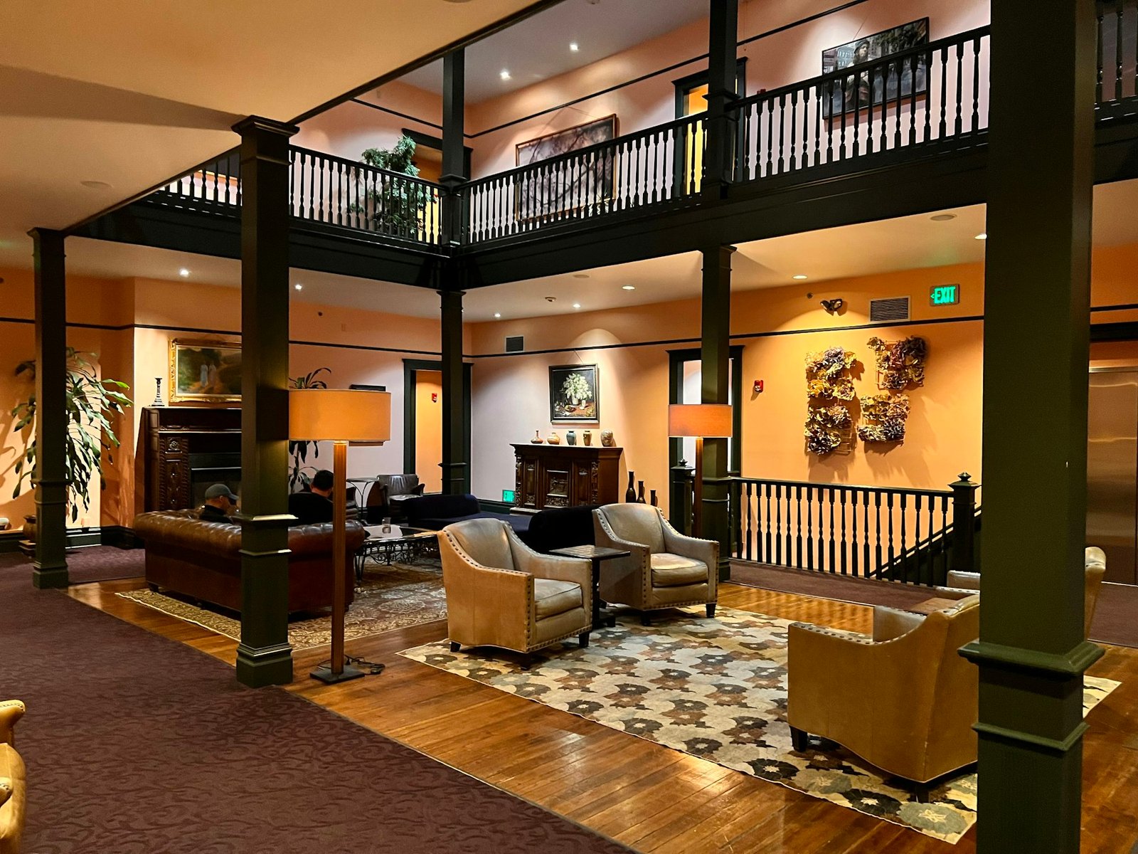 Warmly lit senior living community lounge with comfortable seating